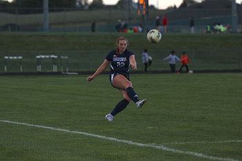 Junior varsity player Molly Ludwig scores as she shoots the ball to the goal.