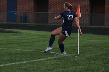 Varsity player Molly Ludwig kicked the ball to her teammates.