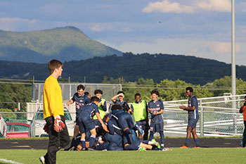 HHS varsity Boys celebrate after scoring a point against East Rock high.