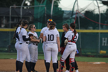 HHS varsity softball team gathered up together for discussion.