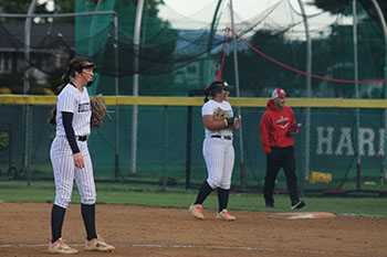 Varsity softball girls playing against the East Rock softball team.