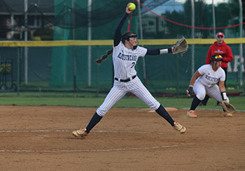 Senior McKenna Dayton prepares to throw the ball to the batter.