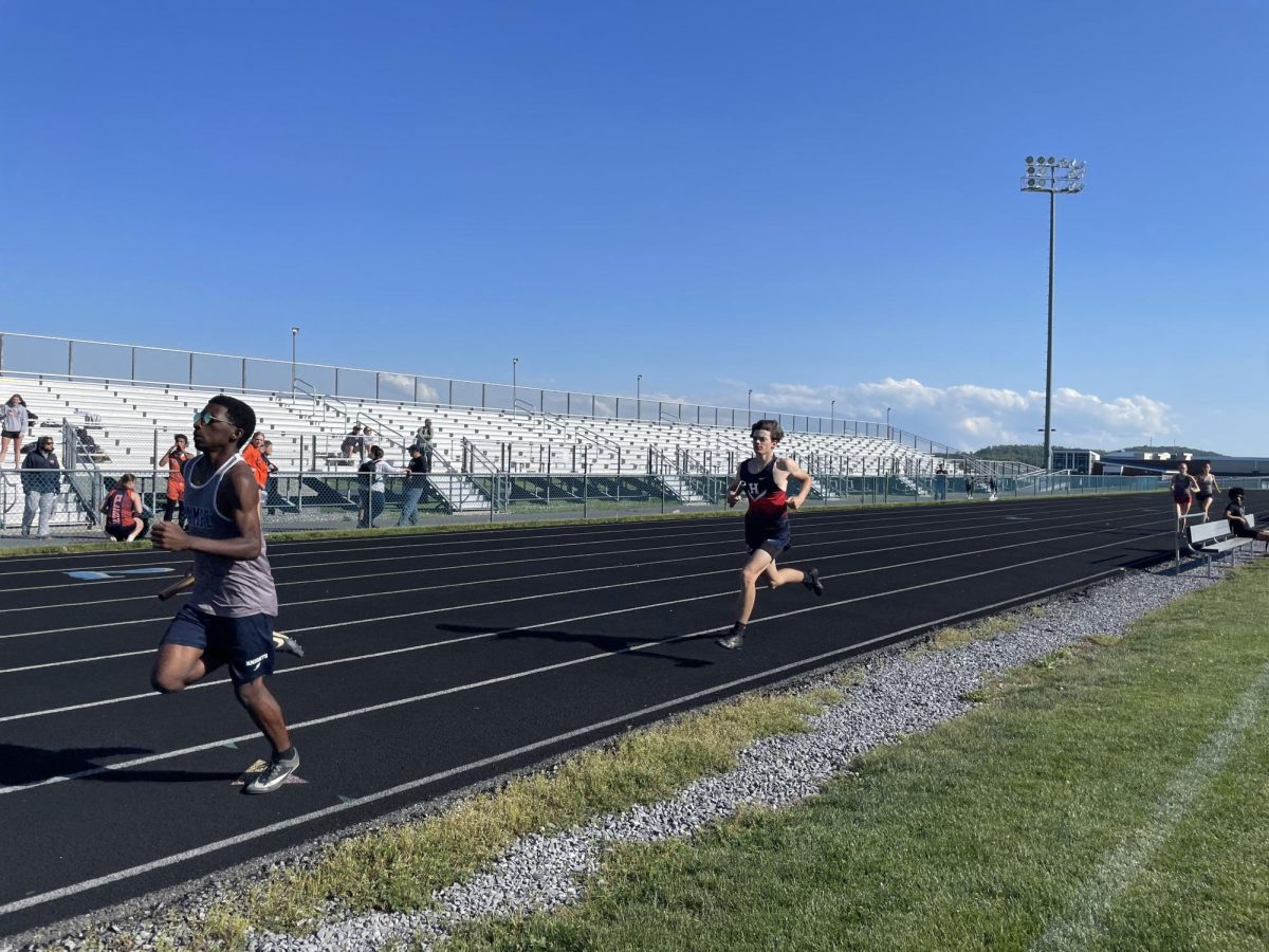 Freshman William Grant runs the four by eight.