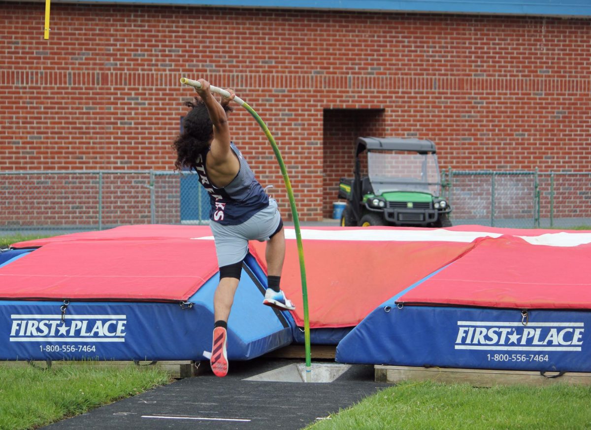 Dominic Rodriguez planting his pole.