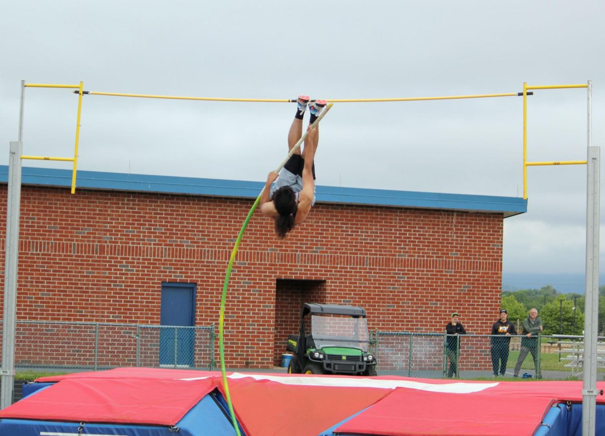 Dominic Rodriguez flying upward from the bend of his pole.