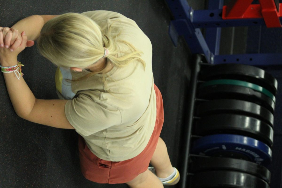 Katie Grace is doing planks working on core strength.