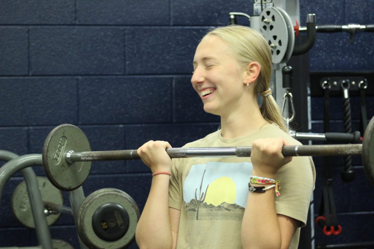 Katie Grace is hitting arms because she enjoys it the most out of all the things.