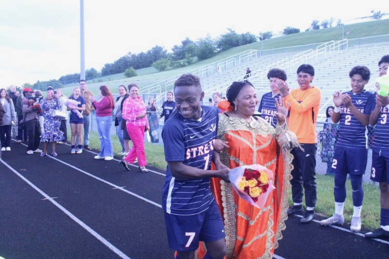 Senior Wilondja Baukyaka laughs with his friends.
