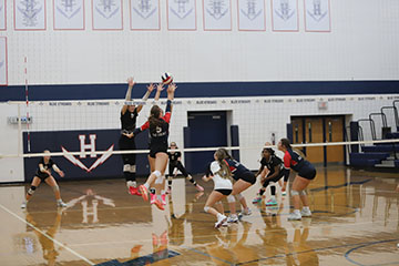 Junior Nora Von Rotz Spikes the ball.