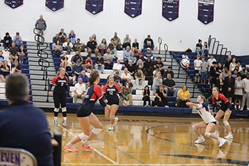 Junior Finny Miller runs to the ball to save it.
