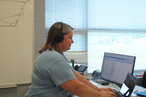 Mrs. Tibbles listens to music while she works. Mrs. Tibbles likes to listen to music while she does her grading. "Journey helps me focus," said Tibbles.