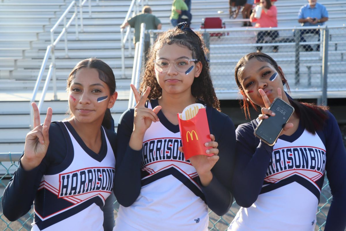 Freshmans Qmani Franklin Fry, Litzy Santos, and Nashlaa Abreu pose for a picture before the game.
