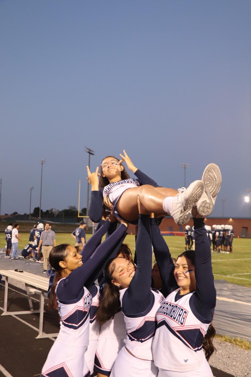 Freshman Nashlaa Abaru getting lifted up by her teammates. 
