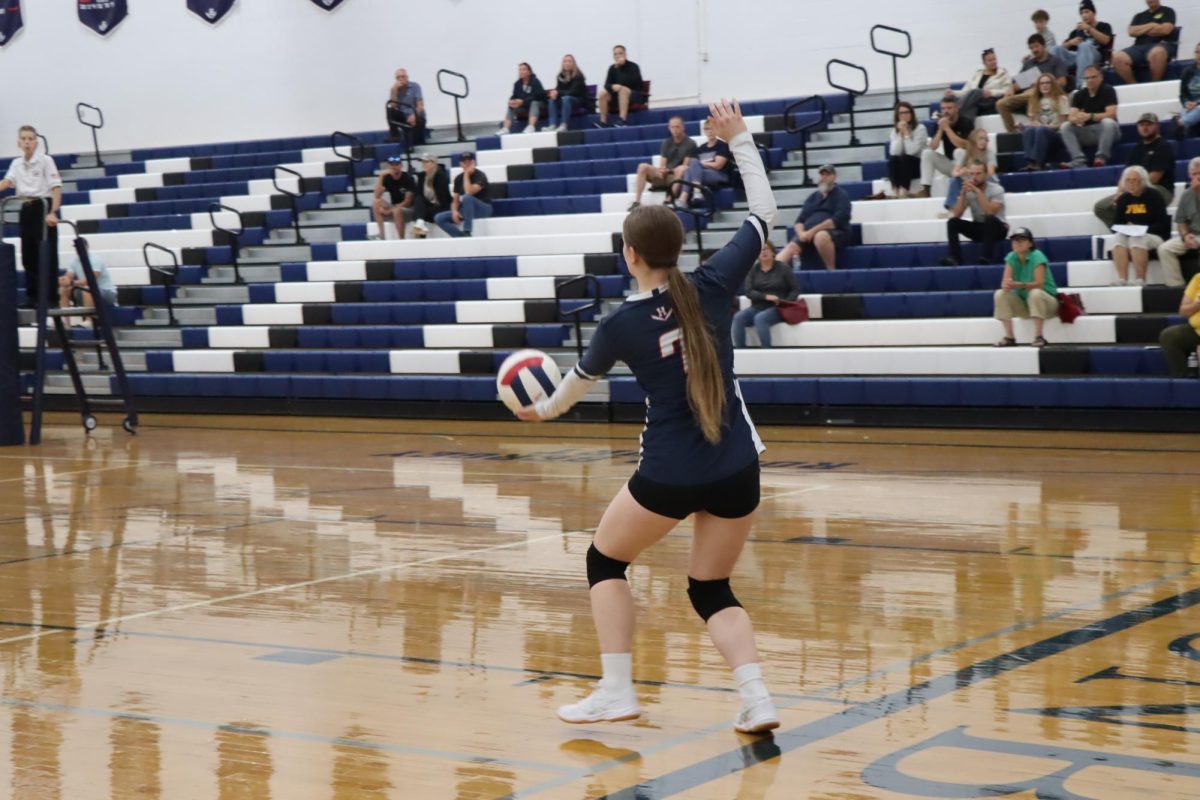 Freshman Corrine playing in Jv volleyball game.