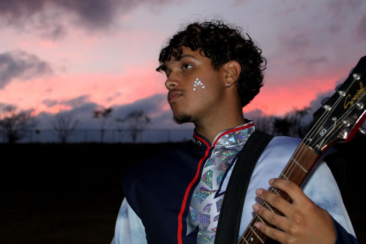 Senior Dorian Rojas Herrera plays electric guitar. 