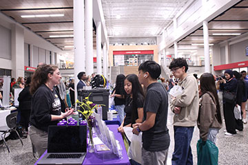 Students talking to a James Madison University representative.
