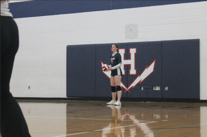 Freshman Corinne Smallwood  gets ready to serve the ball.