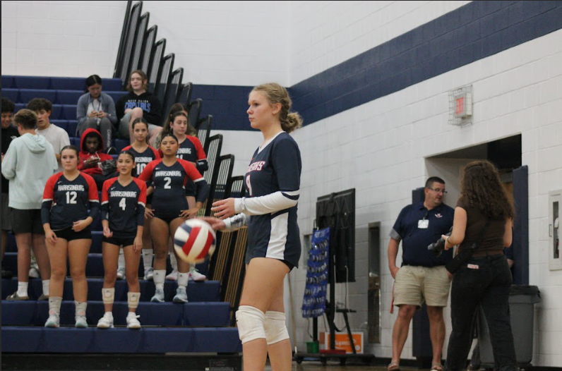 Polina Kazmiruk gets ready to serve that ball to the other team.