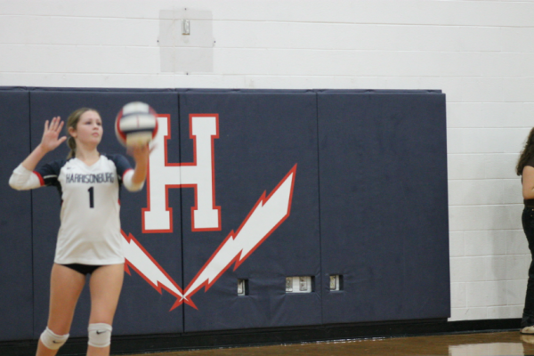 Junior Finnly Miller prepares to serve the ball into play.