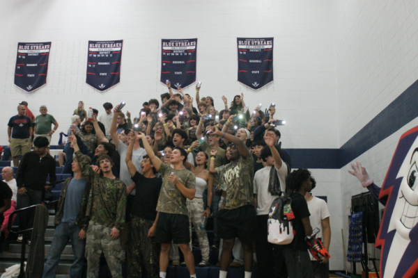 The Strike Zone celebrates the 3-0 win against Rocktown by flashing their phone lights.