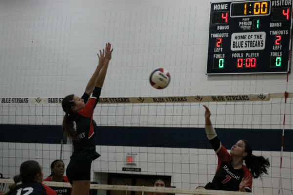 Junior Brynn Smith tries to block the hit from a Rocktown player.