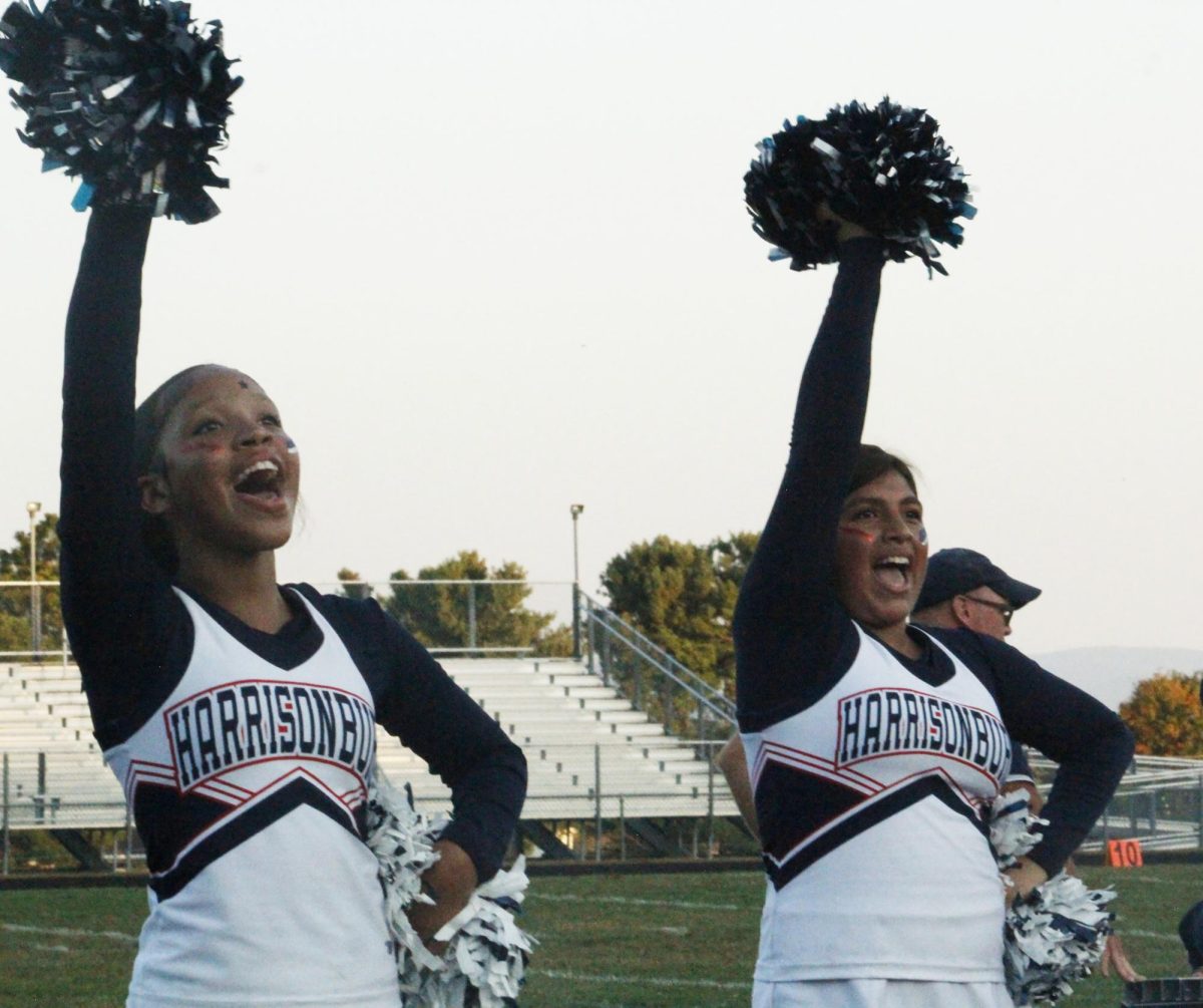 Cheerleaders cheer loud for the Streaks.