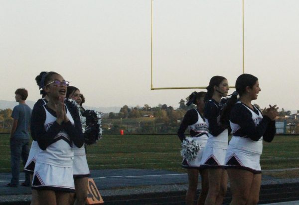 Cheerleaders perform cheers.