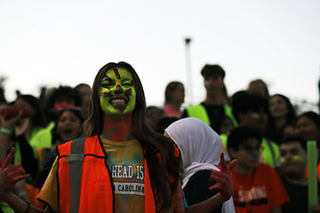 Junior Brynn Smith shows off her awesome neon face paint.