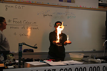 This is Ms. Smith showing her class what you can do with a little bit of liquid and water with fire on her hands.
