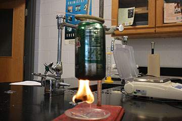 Here's a demonstration of fire burning the soda can to build pressure.