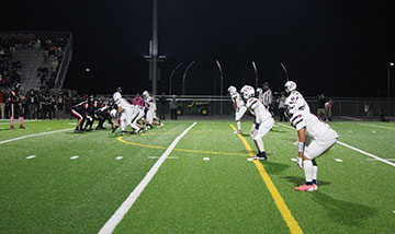 The footballers getting ready to start the game.