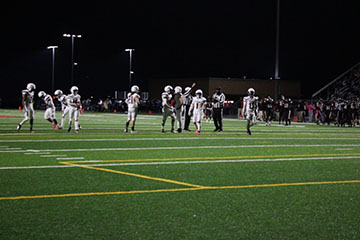 The ref talking to the HHS players if they got the point or not.