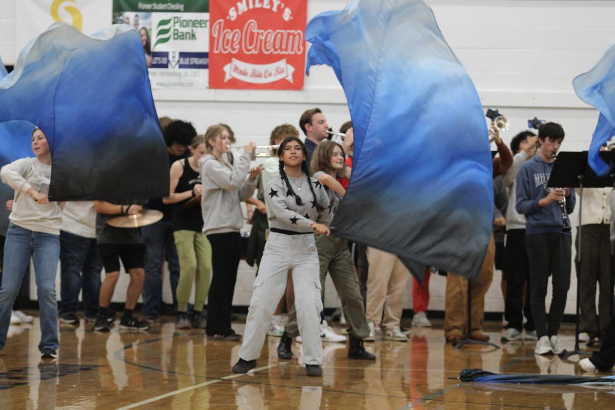 Sophomore Brianna Aceituno performs in last years pep rally with the HHS color guard.
