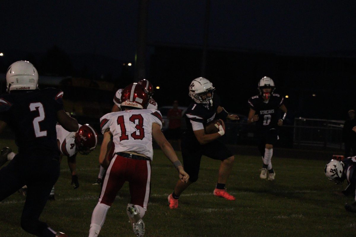 Senior Fernando Rodriguez spinning out of a tackle.