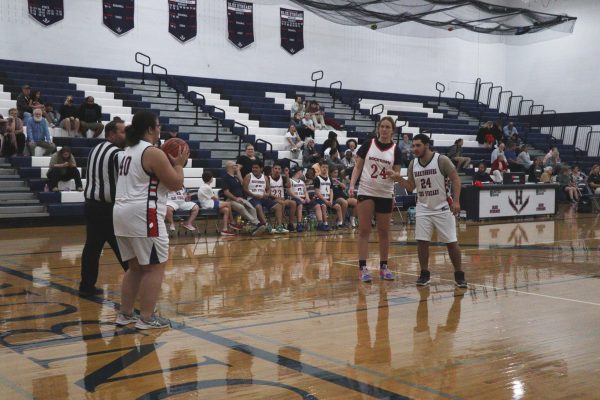 Number 40 gets ready to throw the ball to one of her teammates