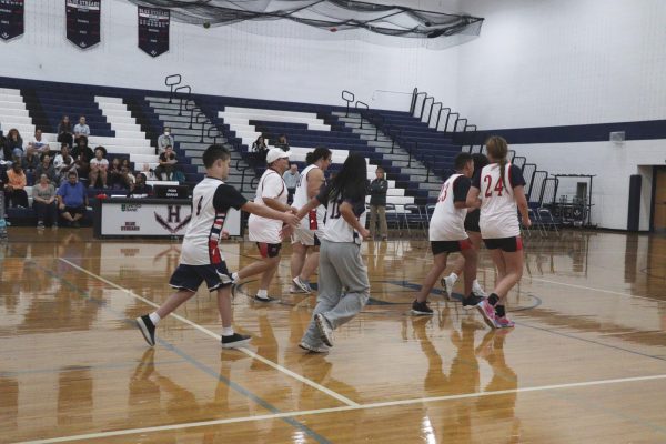 The HHS team running down the court
