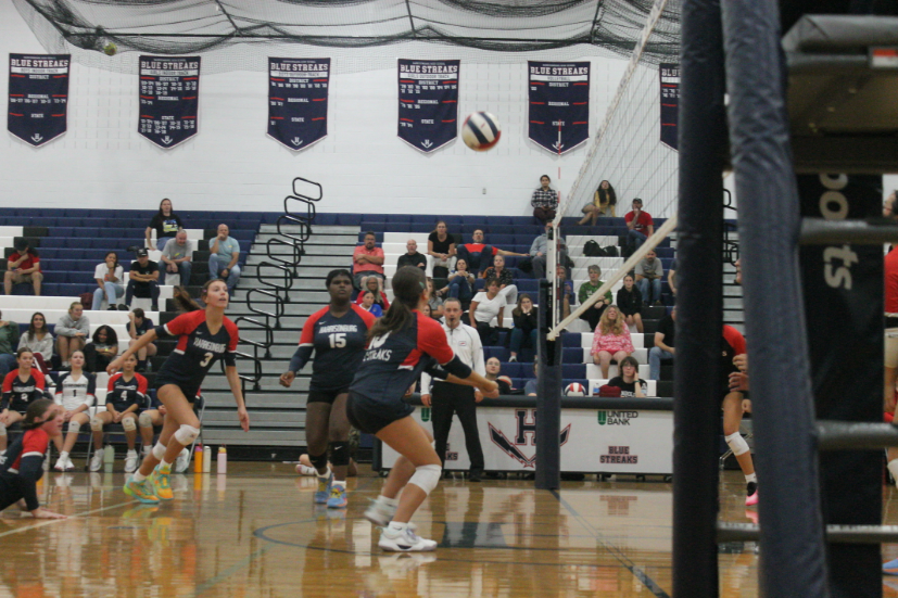 Freshmen Madison Morris passes the ball to her teammate.