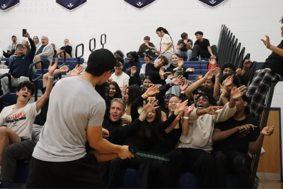 Senior Gabe Sabari leads the Strike Zone in a roller coaster celebration.