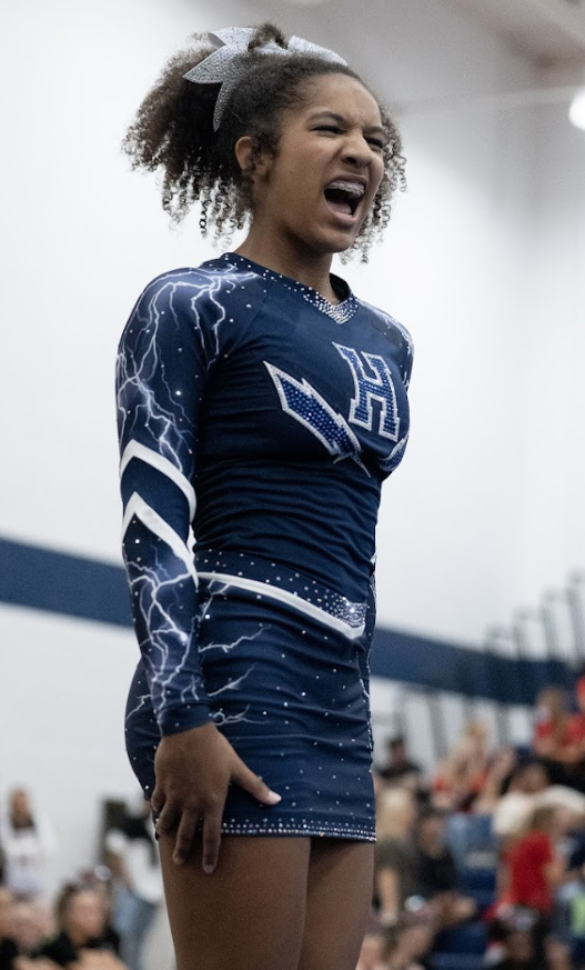 Sophomore Gabrielle Jackson performs at the October Cheer Tournament