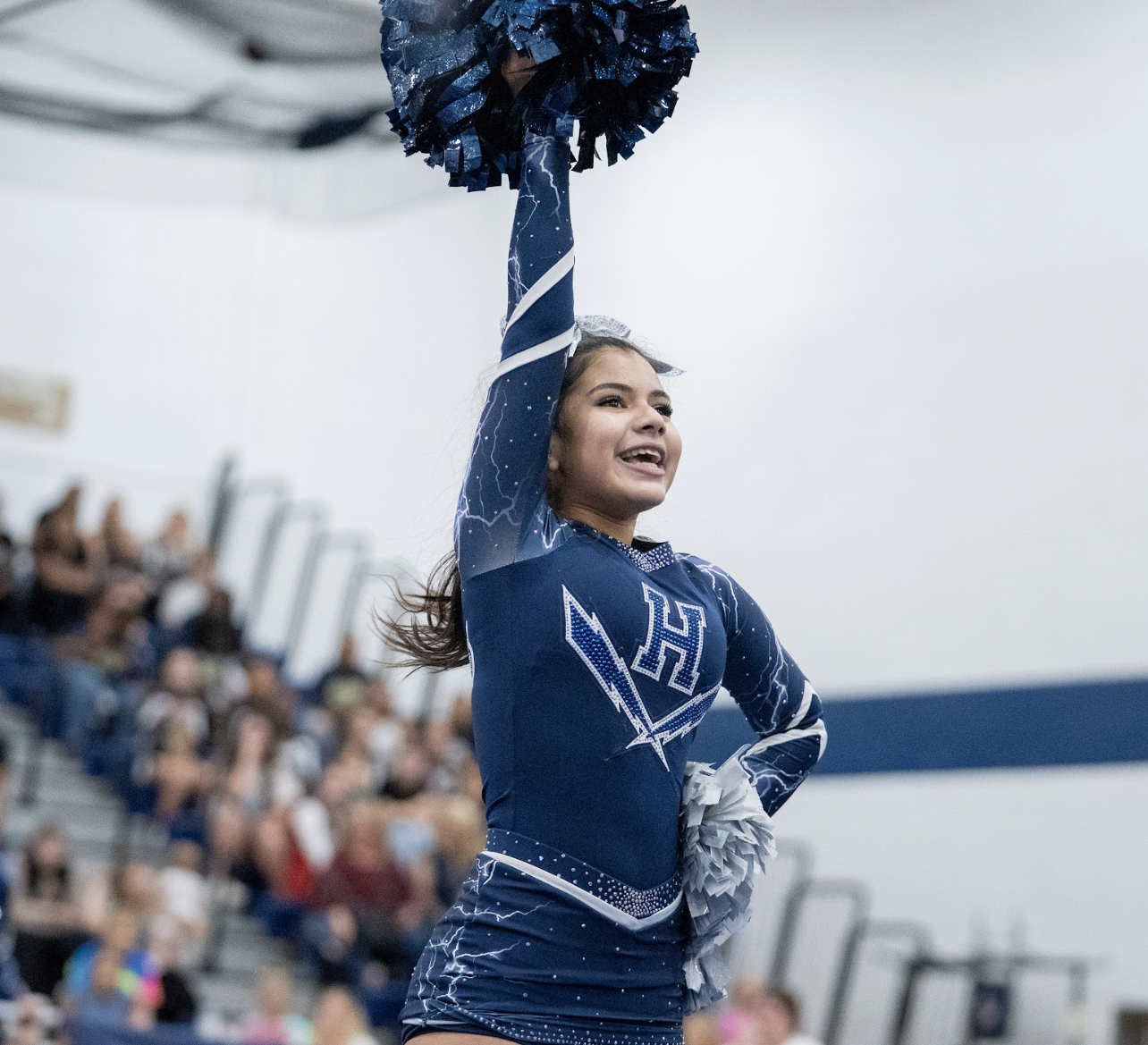 Freshman Mirna Cruz Umana performs at the October Cheer Tournament