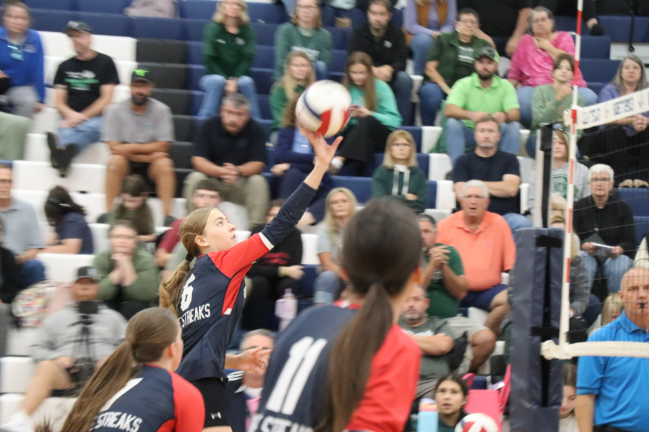 Sophomore Maren Bert spikes the ball over to the other team.