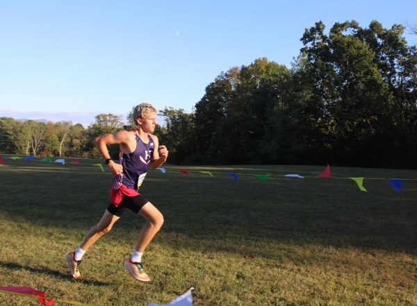 Sophomore Jonah Schmidt finishes his race.