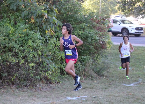 Freshman Abdiel Valdez-Coto rounds the corner during his race.