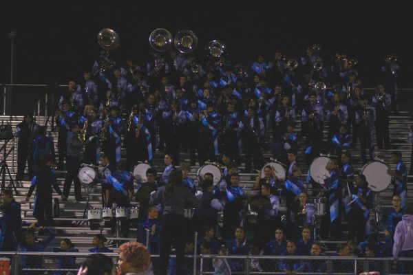 The HHS band helps hype up the field as the game is about to start.