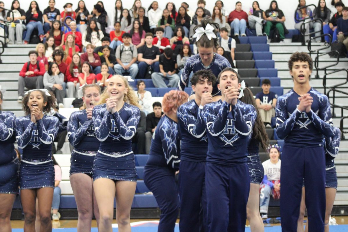 The HHS Varsity Competition Cheer team performs at the pep rally.
