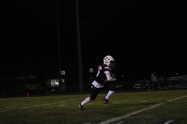 Junior Nathan Slaubaugh makes a catch and runs the ball upfield.