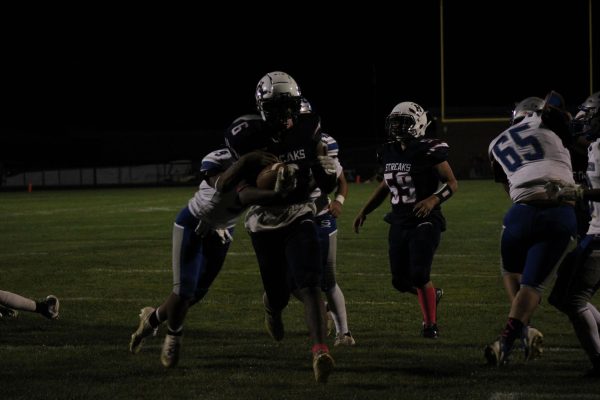 Senior Joel Friebe-Makinto scores the second touchdown of the game for the Harrisonburg Blue Streaks. The Blue Streaks fell to the Blazers of Spotswood last Friday, with a score of 37-14.