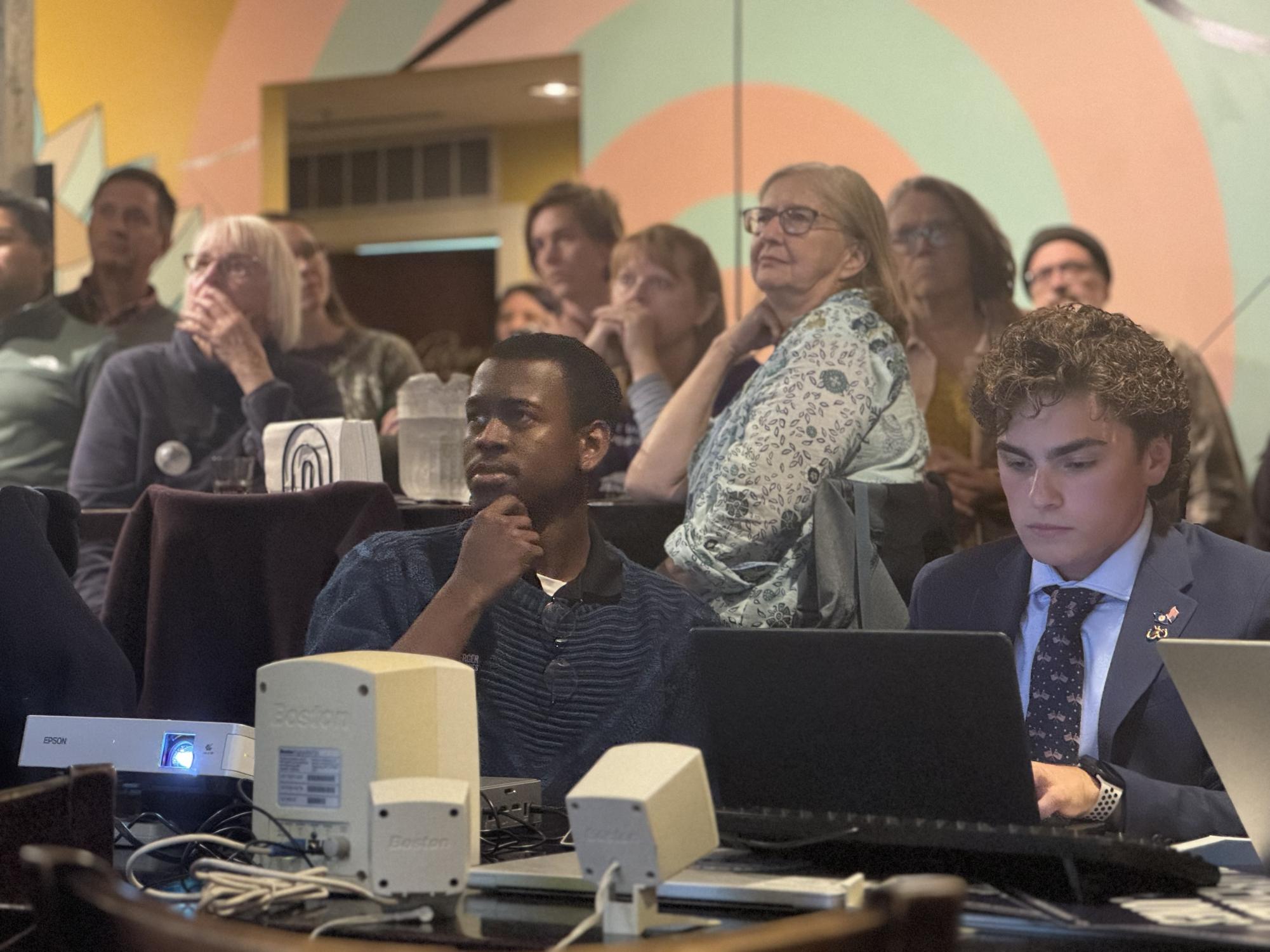 Malachi Drumgole, College Caucus Chair of the Virginia Young Democrats, watches as results come in. "I am excited and enthusiastic that Virginia has come out in support of Spanberger and that she has been projected winner of the gubernatorial election. It sends a message not only to the commonwealth, but out to the nation that we are going to stand against the administration currently sitting on Pennsylvania Avenue  and Congress that we will not be played with," Drumgole said. 