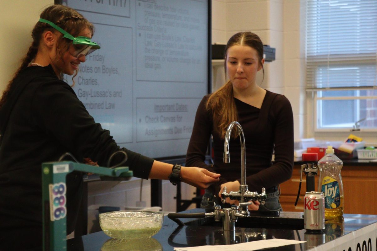 Lucy Hunter and Karina Nyemchenko getting ready to participate with fire and the propane experiment. "We were so nervous for the fire part"- Sophomores Lucy Hunter and Karina Nyemchenko 
