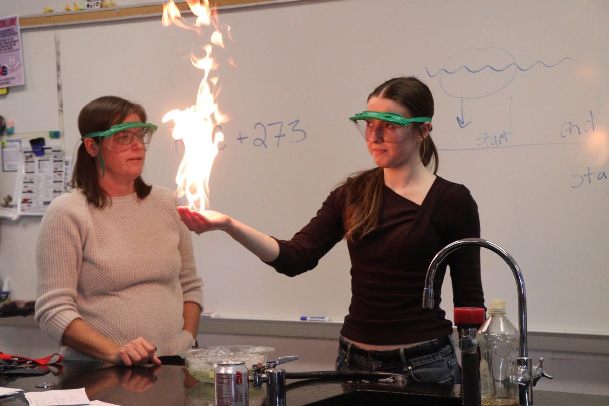 Karina Nyemchenko showing us a science demonstration where flame is used on her hand, while using a controlled experiment. "I was super scared at first but I noticed it wasn't going to hurt which made me not as scared"- Sophomore Karina Nyemchenko 